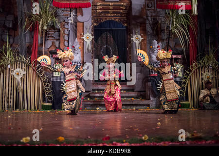 Traditional Balinese Legong dancers performing in a theater in Ubud, Bali, Indonesia. Stock Photo