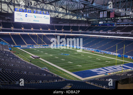 Detroit Lions professional american football club, silhouette of NFL  trophy, logo of the club in background Stock Photo - Alamy