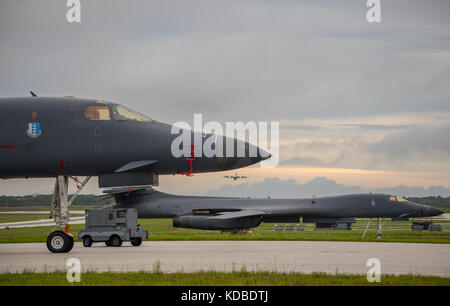 U.S. Air Force B-1B Lancer bombers with the 37th Expeditionary Bomb Squadron prepares to take off to join the Japan Air Self-Defense Force and South Korean Air Force in a joint night operation over the Sea of Japan October 10, 2017 in Guam. The mission marks the first time U.S. Pacific Command B-1B Lancers have conducted combined training with JASDF and ROKAF fighters at night. Stock Photo