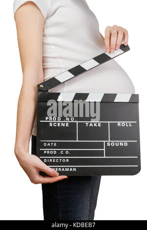Pregnant woman holding clapperboard Stock Photo