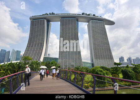 Singapore. The Marina Bay Sands, huge hotel complex with three hotels of 55 floors, a rooftop terrace covering one hectare, 2.560 rooms, a casino and  Stock Photo