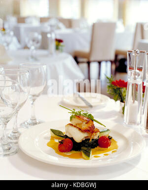 Still life. Food. Restaurant table setting. Roasted Cod. Stock Photo