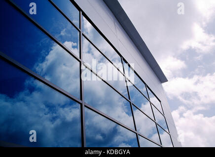 Architecture. Low angle viewpoint of glass façade  section of modern commercial building.