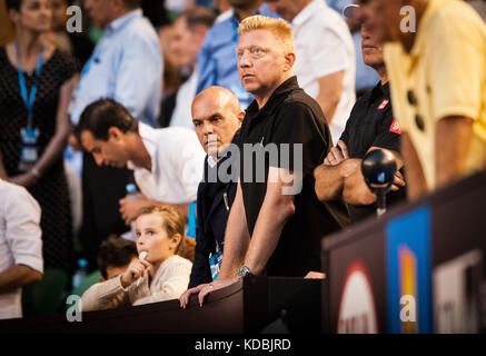 Tennis legend Boris Becker - in black shirt -watches as his student - Novak Djokovic (SRB) went up against unseeded Lucas Lacko (SVK)  in day one play Stock Photo