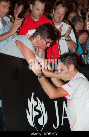 Stanislaus Wawrinka of Switzerland - here with his mother immediately after the match -defeated the number one player in the world R. Nadal of Spain t Stock Photo