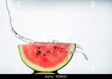 watermelon and water splash on white Stock Photo