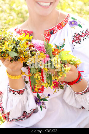Young girl in Ukrainian traditional national costume, Ivan Kupala Day celebration, Kiev, Pirogovo, Ukraine. Stock Photo