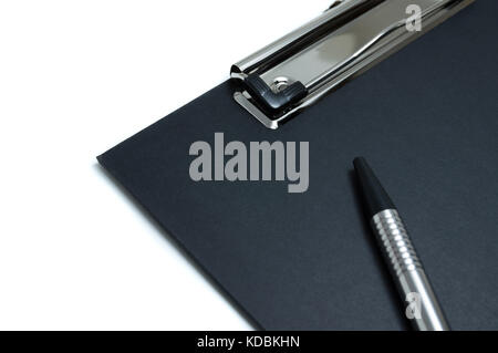 Black clipboard with a pen isolated on white background Stock Photo