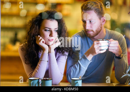 Young attractive couple having problems on date Stock Photo