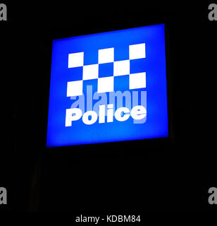 Police sign outside New South Wales police station at night