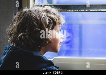 Boy on a train Stock Photo