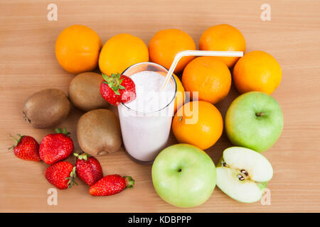 Close-up Of Strawberry Milkshake And Fruits On The Table Stock Photo