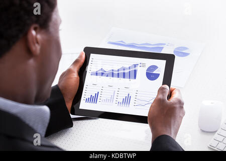 Close-up Of Businessman Looking At Digital Tablet Stock Photo