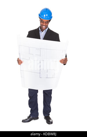 Happy African Architect Looking At Blueprint Isolated Over White Background Stock Photo
