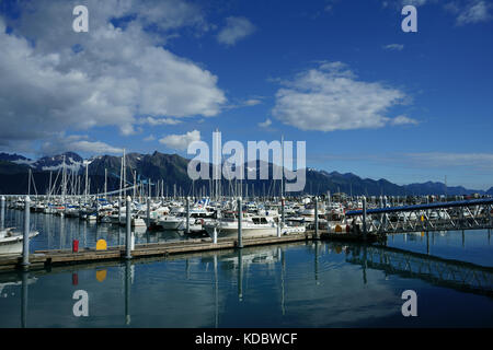 Boatharbor in Seward with cumulus clouds, Kenai Peninsula, Alaska Stock Photo