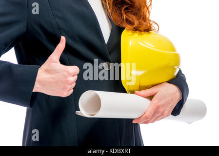 Successful architect conceptual photo - hard hat and blueprints in hands closeup Stock Photo