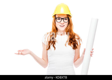 young beautiful red-haired woman with blueprints in a yellow hard hat against a white background Stock Photo