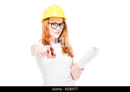 horizontal portrait of confident woman in yellow helmet with blueprints on white background Stock Photo