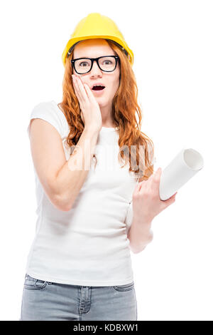 shocked woman in yellow helmet in studio posing Stock Photo