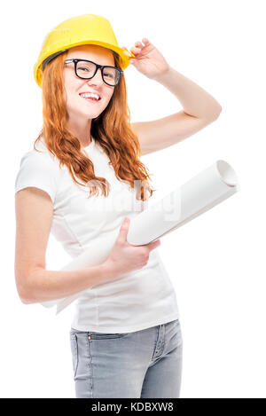 Builder young woman with projects in a yellow hard hat against a white background Stock Photo