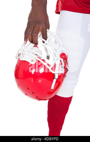 Close-up Of African American Football Player Holding Red Helmet Stock Photo