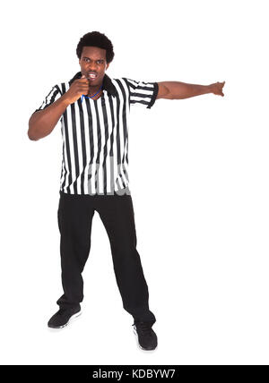 Portrait Of An Angry African Referee Isolated Over White Background Stock Photo