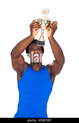 Portrait Of Happy African Athlete Over White Background Holding Trophy Stock Photo