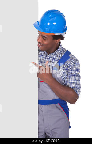 Craftsman Behind Placard Showing Thumb Up Sign Over White Background Stock Photo