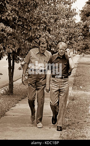 1976 Democratic presidential nominee Jimmy Carter walks through his hometown of Plains, Georgia while talking with former Maine Senator Edmund Muskie. Stock Photo