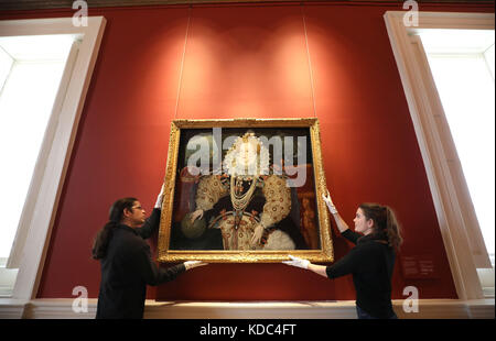 Art handlers reinstall the Armada Portrait of Elizabeth I in the