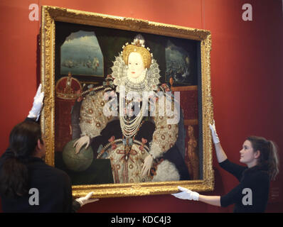 Art handlers reinstall the Armada Portrait of Elizabeth I in the