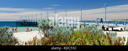 Families enjoying sandy beach on sunny day at Palm Beach Jetty, Rockingham. Stock Photo