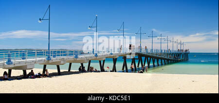 Families enjoying sandy beach on sunny day at Palm Beach Jetty, Rockingham. Stock Photo