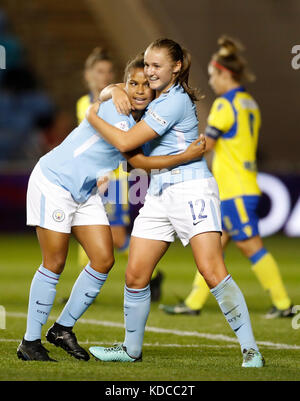 Manchester City's Nikita Parris (left) celebrates scoring her side's first goal of the game during the UEFA Women's Champions League round of 32 second leg match at the City Football Academy, Manchester. Stock Photo