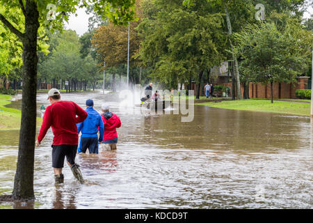 Houston area residents navigate high waters. Heavy rains from hurricane Harvey caused floods in many areas around Houston. Stock Photo