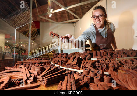 Giovanna Schettini displays tools and implements fashioned completely from chocolate at The Chocolate Show, at Kensington Olympia, London. Stock Photo