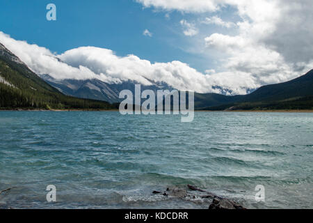 Beautiful mountains serve as a backdrop to the Spray Lakes Reservoir in Kananaskis country. Stock Photo