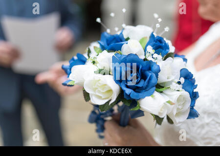 Close up of an blue and white wedding bouquet held by bride Stock Photo