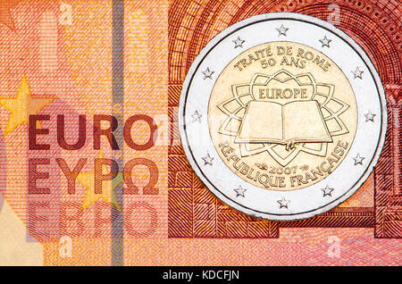 French 2 Euro coin on a 10 Euro note: 50th anniversary of the Treaty of Rome (2007) Stock Photo