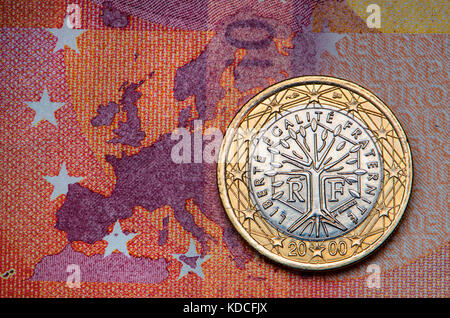 French 1 Euro coin on a 10 Euro note Stock Photo