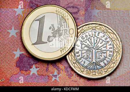 French 1 Euro coin on a 10 Euro note Stock Photo