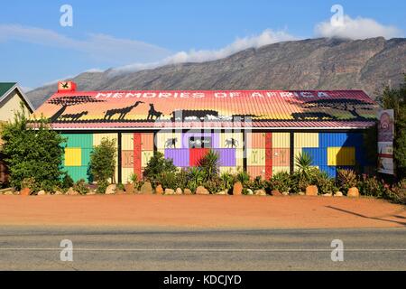 Colorful shop decorated with African wildlife silhouette, located in mountainous Klein Karoo and Overberg region, Barrydale, Garden Route South Africa Stock Photo