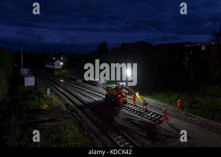 Re laying track  early on a Sunday morning at  Poulton-Le-Fylde on the Preston -  Blackpool north line.  Network rail Stock Photo