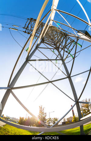 High voltage power line against the blue sky Stock Photo - Alamy
