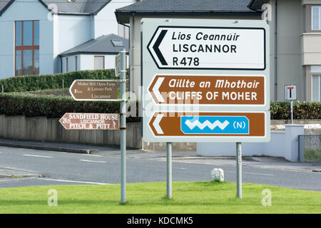 Road sign for Liscannor, the Cliffs of Moher, and the Wild Atlantic Way at Lahinch in county Clare in Ireland Stock Photo