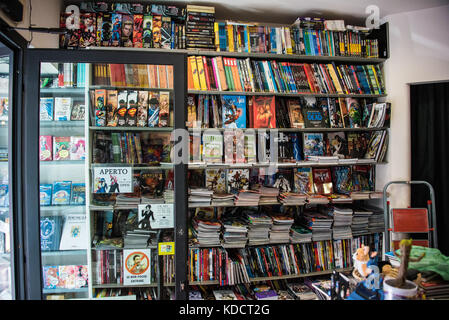 Comic Book Store in Florence, Italy with wall full of comic books Stock Photo