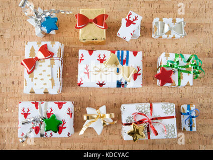 Little wrapped presents with shiny ribbons and bows for christmas Stock Photo