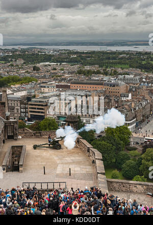 Firing of the One o'clock gun at Edinburgh castle in Scotland. Stock Photo