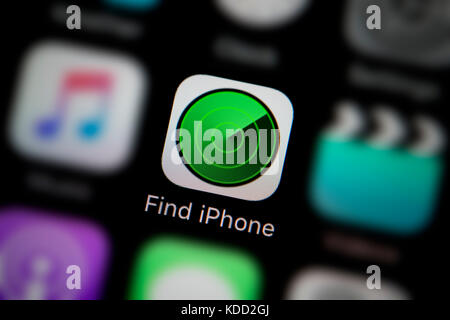 A close-up shot of the logo representing Find iPhone app icon, as seen on the screen of a smart phone (Editorial use only) Stock Photo