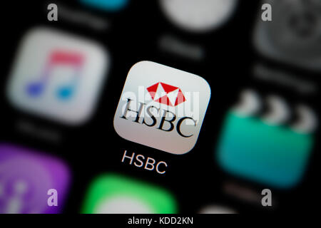 A close-up shot of the logo representing HSBC Bank app icon, as seen on the screen of a smart phone (Editorial use only) Stock Photo